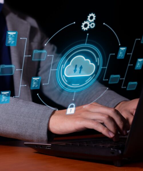 Man uses cloud computing on his computer to transmit, store, backup important data and information